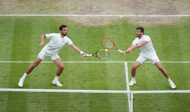 Nikola Mektic of Croatia and Mate Pavic of Croatia in action during their Men's Doubles Final match against Marcel Granollers of Spain and Horacio...