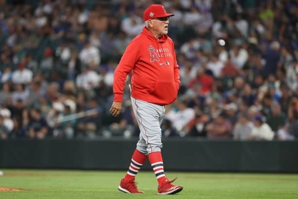 Manager Joe Maddon of the Los Angeles Angels looks on after making a pitching change during the sixth inning against the Seattle Mariners at T-Mobile...