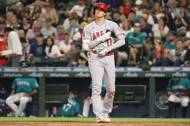 Shohei Ohtani of the Los Angeles Angels reacts while at bat during the seventh inning against the Seattle Mariners at T-Mobile Park on July 09, 2021...
