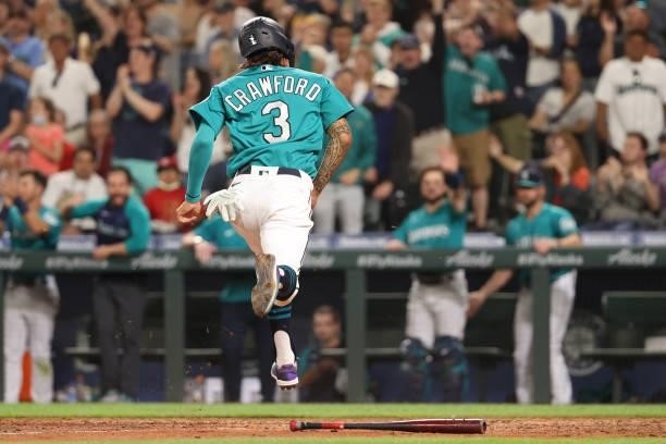 Crawford scores off an RBI single by Ty France of the Seattle Mariners to tie the game 3-3 during the seventh inning against the Los Angeles Angels...