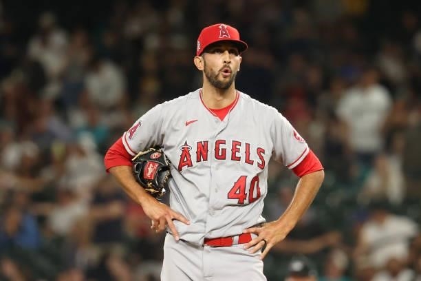 Steve Cishek of the Los Angeles Angels reacts after giving up an RBI single to Ty France of the Seattle Mariners to tie the game 3-3 during the...