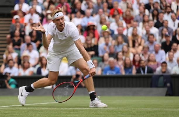 Denis Shapovalov of Canada plays a backhand volley in his Men's Singles Semi-Final match against Novak Djokovic of Serbia during Day Eleven of The...