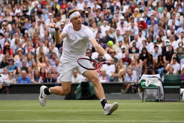 Denis Shapovalov of Canada plays a backhand volley in his Men's Singles Semi-Final match against Novak Djokovic of Serbia during Day Eleven of The...