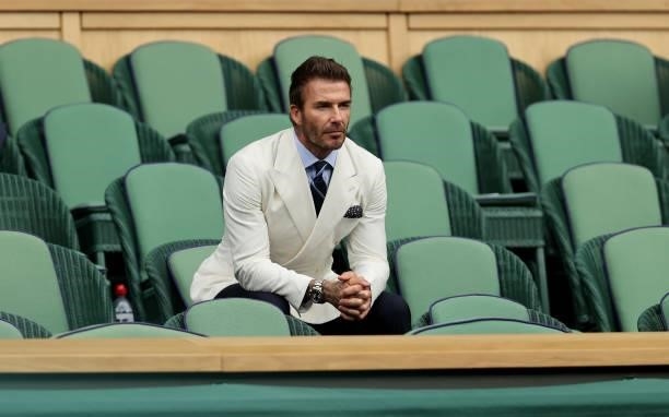 David Beckham, former football player looks on from the Royal Box during the Men's Singles Semi-Final match between Novak Djokovic of Serbia and...