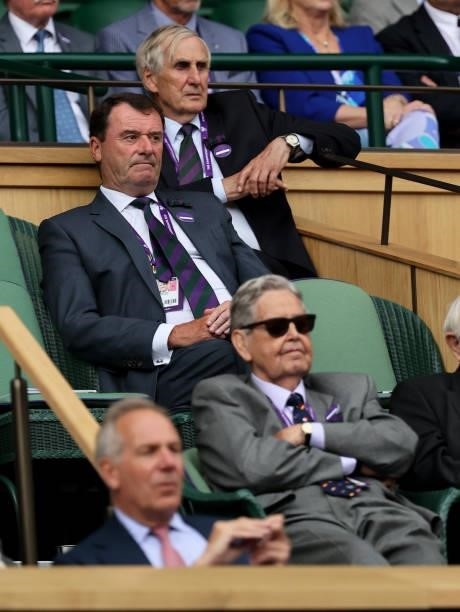 Former AELTC Chairmen Tim Phillips,Philip Brook and John Curry look on from the Royal Box during the Men's Singles Semi-Final match between Novak...