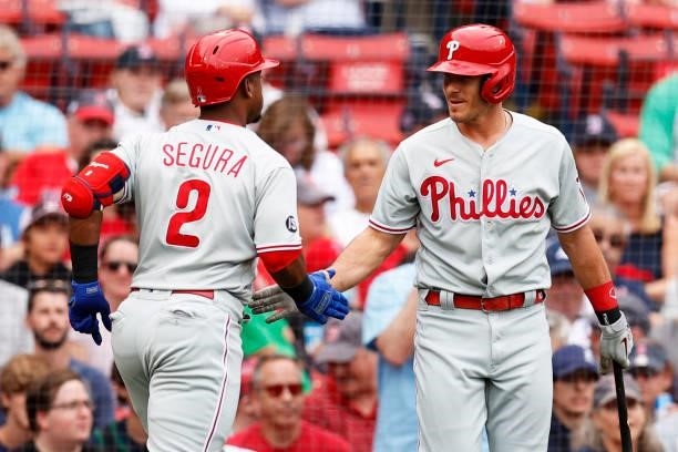 Jean Segura of the Philadelphia Phillies celebrates with J.T. Realmuto after hitting a home run against the Boston Red Sox during the first inning at...