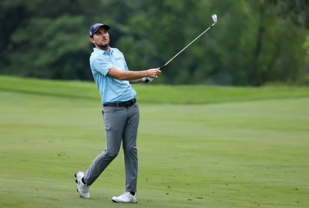 Russell Henley plays his third shot on the 15th hole during the third round of the John Deere Classic at TPC Deere Run on July 10, 2021 in Silvis,...