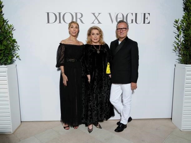Mathilde Favier, Catherine Deneuve and guest attend the Dior dinner during the 74th annual Cannes Film Festival on July 10, 2021 in Cannes, France.