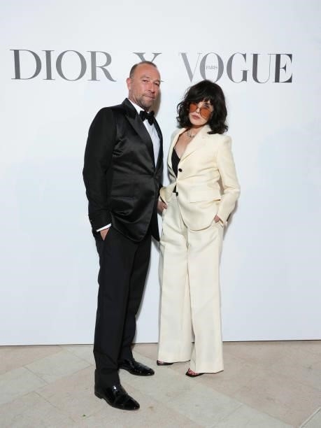 Jerome Pulis and Isabelle Adjani attends the Dior dinner during the 74th annual Cannes Film Festival on July 10, 2021 in Cannes, France.