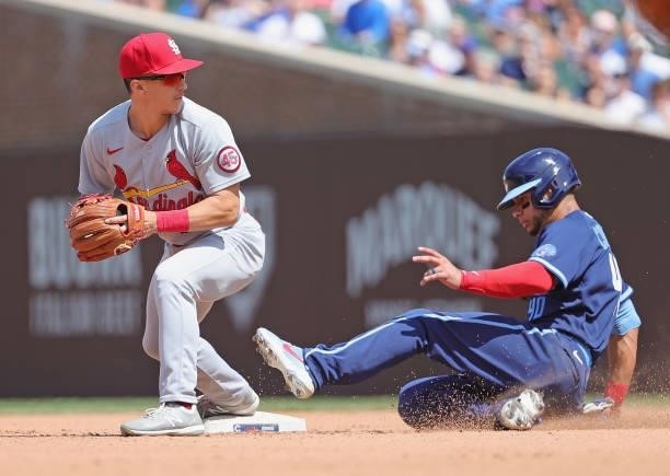 Tommy Edman of the St. Louis Cardinals forces Willson Contreras of the Chicago Cubs at second base at Wrigley Field on July 09, 2021 in Chicago,...
