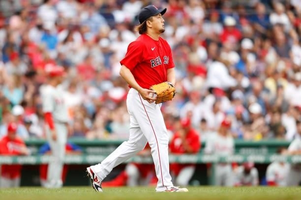 Hirokazu Sawamura of the Boston Red Sox prepares to throw against the Philadelphia Phillies during the fourth inning at Fenway Park on July 10, 2021...