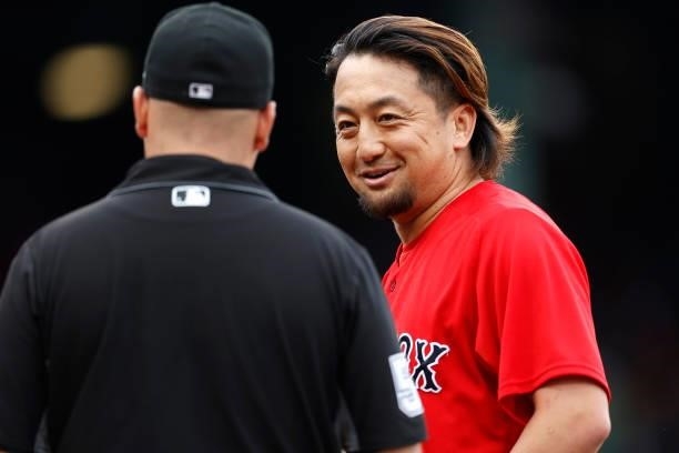 Umpire Jansen Visconti completes a foreign substance check on Hirokazu Sawamura of the Boston Red Sox after he pitched the fourth inning at Fenway...