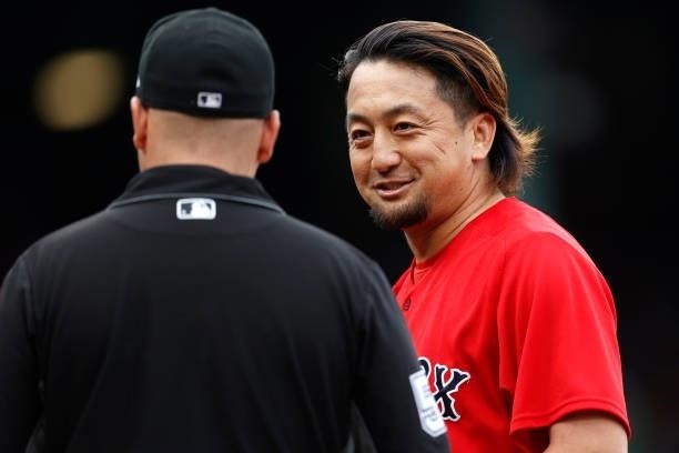 Umpire Jansen Visconti completes a foreign substance check on Hirokazu Sawamura of the Boston Red Sox after he pitched the fourth inning at Fenway...