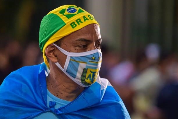 Street vendor stands with his merchandise outside the stadium prior to the final of Copa America Brazil 2021 between Brazil and Argentina at Maracana...