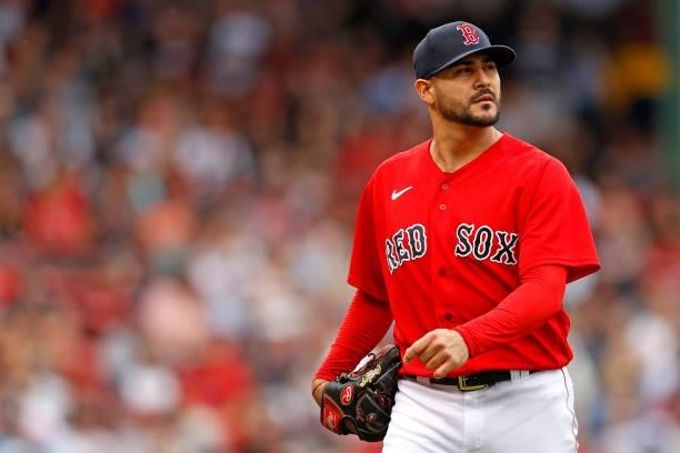 Martin Perez of the Boston Red Sox walks to the dugout after pitching the third inning against the Philadelphia Phillies at Fenway Park on July 10,...