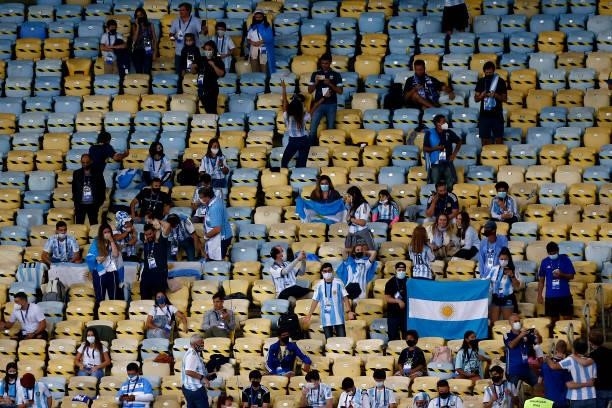 Fans of Argentina await the start of the match in the stands prior to the final of Copa America Brazil 2021 between Brazil and Argentina at Maracana...