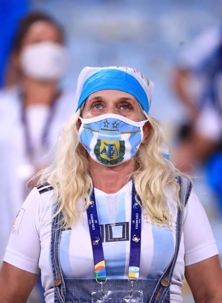 Fan of Argentina wearing a facemask of the Argentine team waits for the start of the match prior to the final of Copa America Brazil 2021 between...