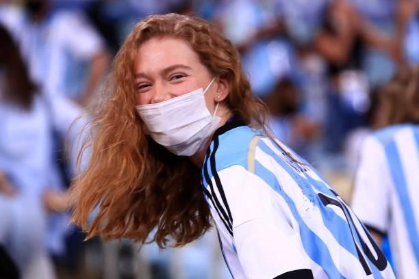 Fan of Argentina wearing a facemask waits for the start of the match prior to the final of Copa America Brazil 2021 between Brazil and Argentina at...