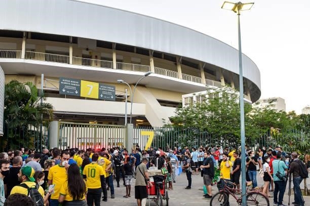 Fans arrive to the stadium prior to the final of Copa America Brazil 2021 between Brazil and Argentina at Maracana Stadium on July 10, 2021 in Rio de...