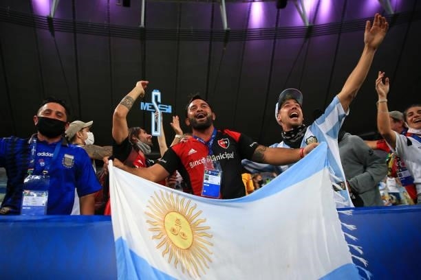 Fans of Argentina cheer with a flag in the stands prior to the final of Copa America Brazil 2021 between Brazil and Argentina at Maracana Stadium on...