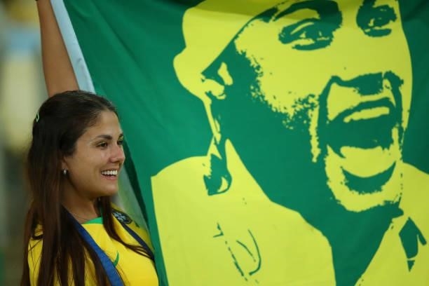 Fan of Brazil holds a flag of Neymar Jr. In the stands prior to the final of Copa America Brazil 2021 between Brazil and Argentina at Maracana...