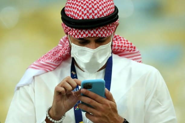 Fan looks at his phone in the stands prior to the final of Copa America Brazil 2021 between Brazil and Argentina at Maracana Stadium on July 10, 2021...