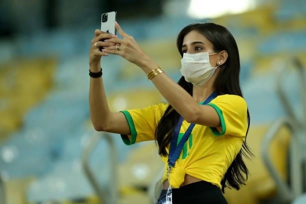 Fan of Brazil takes pictures in the stands prior to the final of Copa America Brazil 2021 between Brazil and Argentina at Maracana Stadium on July...