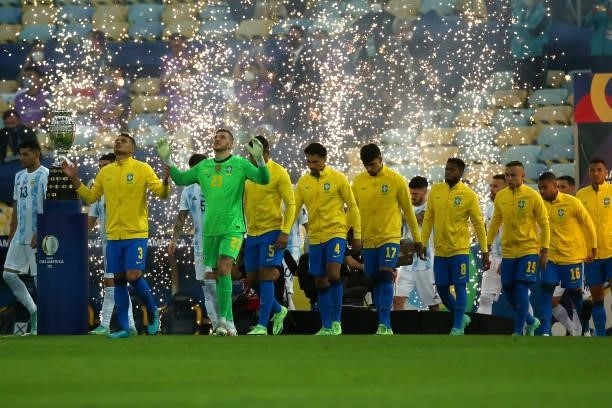 Thiago Silva and Ederson of Brazil lead their team as they enter the pitch prior to the final of Copa America Brazil 2021 between Brazil and...