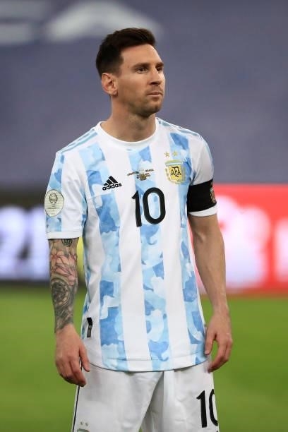 Lionel Messi of Argentina looks on for the national anthem prior to the final of Copa America Brazil 2021 between Brazil and Argentina at Maracana...