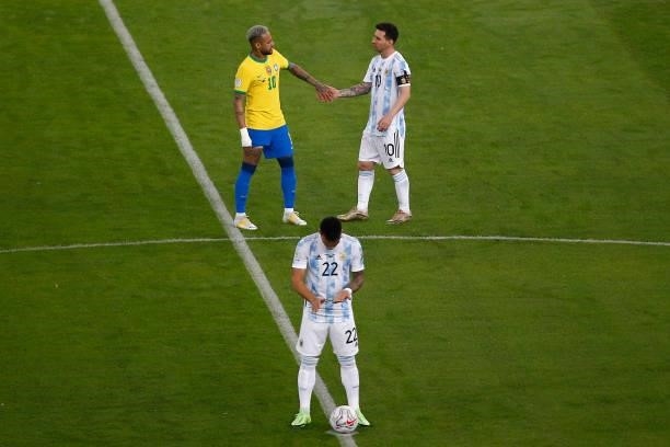 Neymar Jr. Of Brazil greets Lionel Messi of Argentina as Lautaro Martinez of Argentina prepares for kick off prior to the final of Copa America...