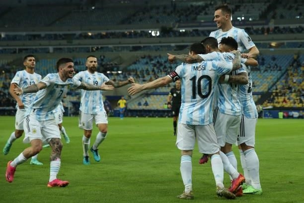 Angel Di Maria of Argentina celebrates with teammates after scoring the first goal of his team during the final of Copa America Brazil 2021 between...