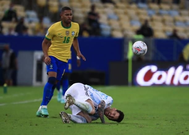 Lionel Messi of Argentina reacts as he falls during the final of Copa America Brazil 2021 between Brazil and Argentina at Maracana Stadium on July...