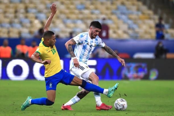 Rodrigo De Paul of Argentina fights for the ball with Renan Lodi of Brazil during the final of Copa America Brazil 2021 between Brazil and Argentina...