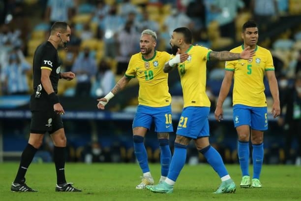 Neymar Jr. Of Brazil and teammates Gabriel Barbosa and Casemiro of Brazil react against Referee Esteban Ostojich during the final of Copa America...