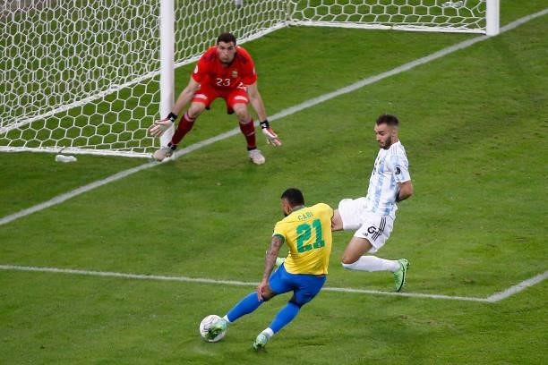 Gabriel Barbosa of Brazil kicks the ball on target against German Pezzella and Emiliano Martinez of Argentina during the final of Copa America Brazil...