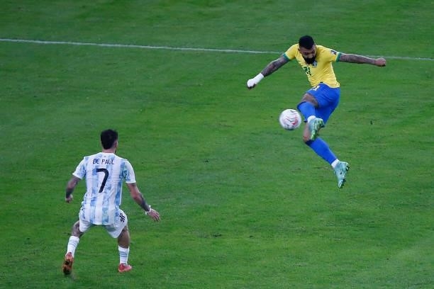 Gabriel Barbosa of Brazil controls the ball against Rodrigo De Paul of Argentina during the final of Copa America Brazil 2021 between Brazil and...