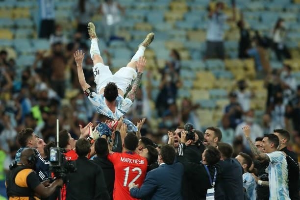 Players of Argentina lift in the air their captain Lionel Messi after winning the final of Copa America Brazil 2021 between Brazil and Argentina at...