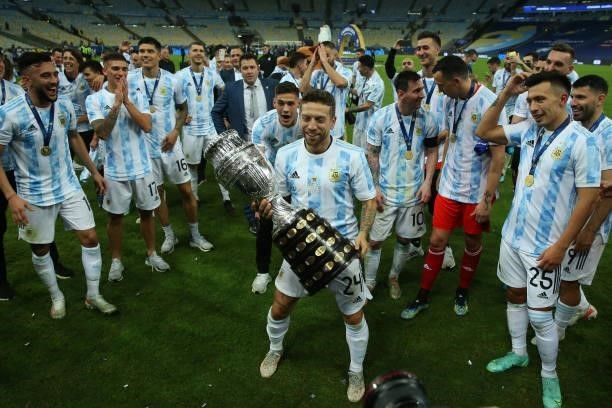 Alejandro Gomez of Argentina celebrates with the trophy and teammates after winning during the final of Copa America Brazil 2021 between Brazil and...