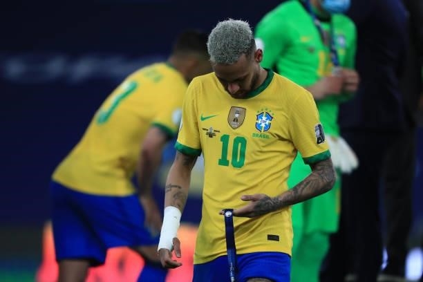Neymar Jr. Of Brazil looks at his second place medal after the final of Copa America Brazil 2021 between Brazil and Argentina at Maracana Stadium on...