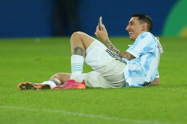 Angel Di Maria of Argentina celebrates as he talks on his phone after winning the final of Copa America Brazil 2021 between Brazil and Argentina at...