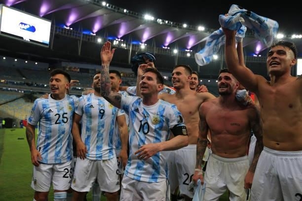 Lionel Messi of Argentina celebrates with teammates Sergio Agüero, Rodrigo De Paul and Lisandro Martinez after winning the final of Copa America...