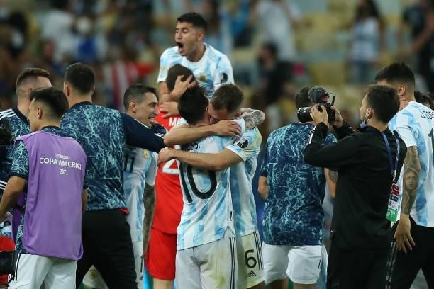 Lionel Messi of Argentina hugs teammate German Pezzella after winning the final of Copa America Brazil 2021 between Brazil and Argentina at Maracana...