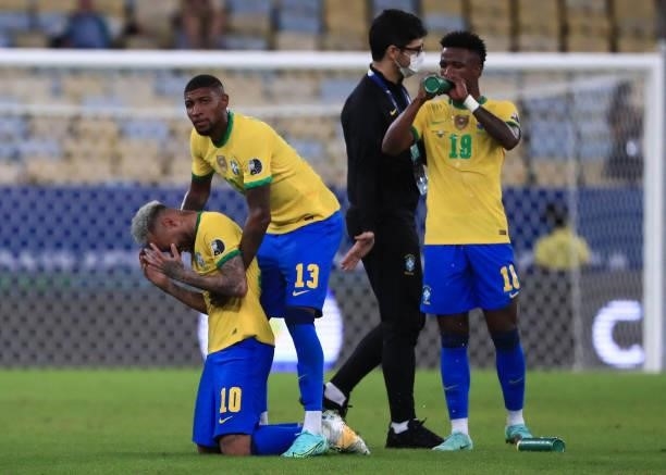 Neymar Jr. Of Brazil reacts as he is comforted by teammate Emerson after the final of Copa America Brazil 2021 between Brazil and Argentina at...