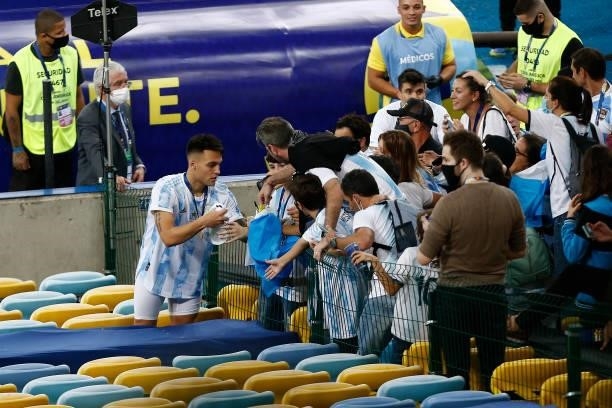 Lautaro Martinez of Argentina signs jerseys for fans after winning the final of Copa America Brazil 2021 between Brazil and Argentina at Maracana...