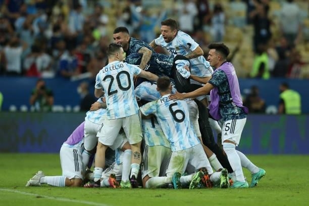 Giovani Lo Celso, German Pezzella, Leandro Paredes, Alejandro Gomez of Argentina jump to celebrate with their captain Lionel Messi after winning the...
