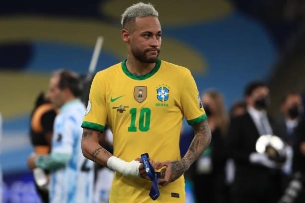 Neymar Jr. Of Brazil takes off his second place medal after the final of Copa America Brazil 2021 between Brazil and Argentina at Maracana Stadium on...