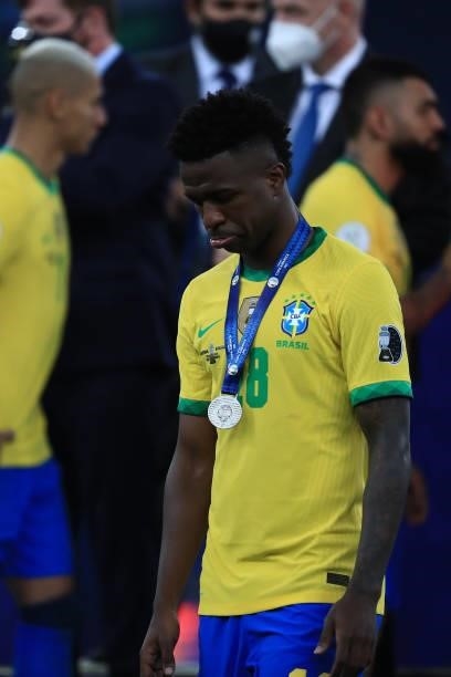 Vinicius Junior of Brazil reacts with his second place medal during the final of Copa America Brazil 2021 between Brazil and Argentina at Maracana...