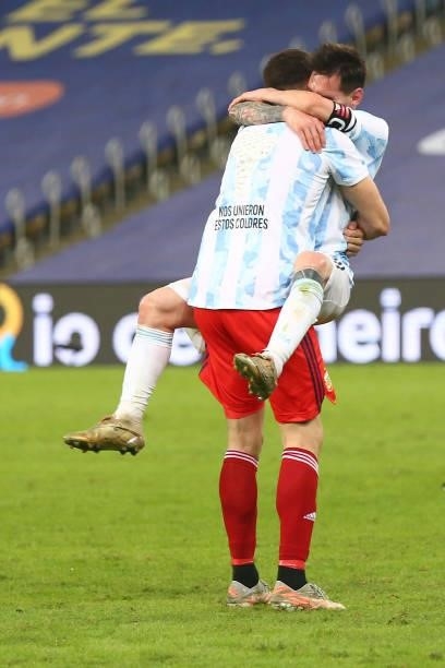 Lionel Messi of Argentina hugs teammate Emiliano Martinez after winning the final of Copa America Brazil 2021 between Brazil and Argentina at...