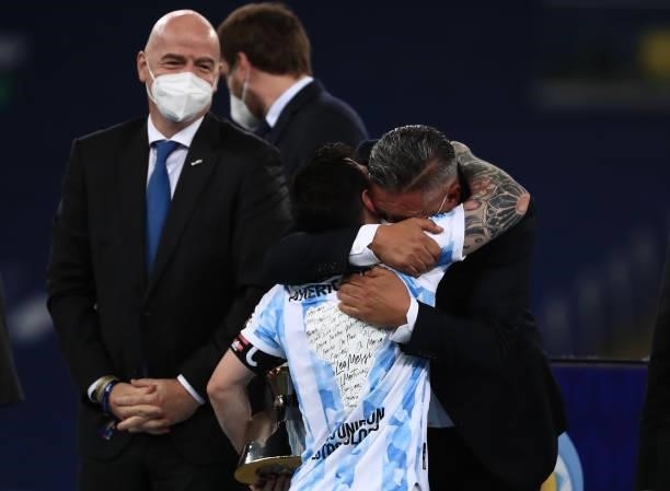 Lionel Messi of Argentina receives his top scorer award from President of CONMEBOL Alejandro Dominguez and President of FIFA Gianni Infantino after...