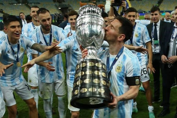 Lionel Messi of Argentina kisses the trophy as he celebrates with teammates after winning the final of Copa America Brazil 2021 between Brazil and...